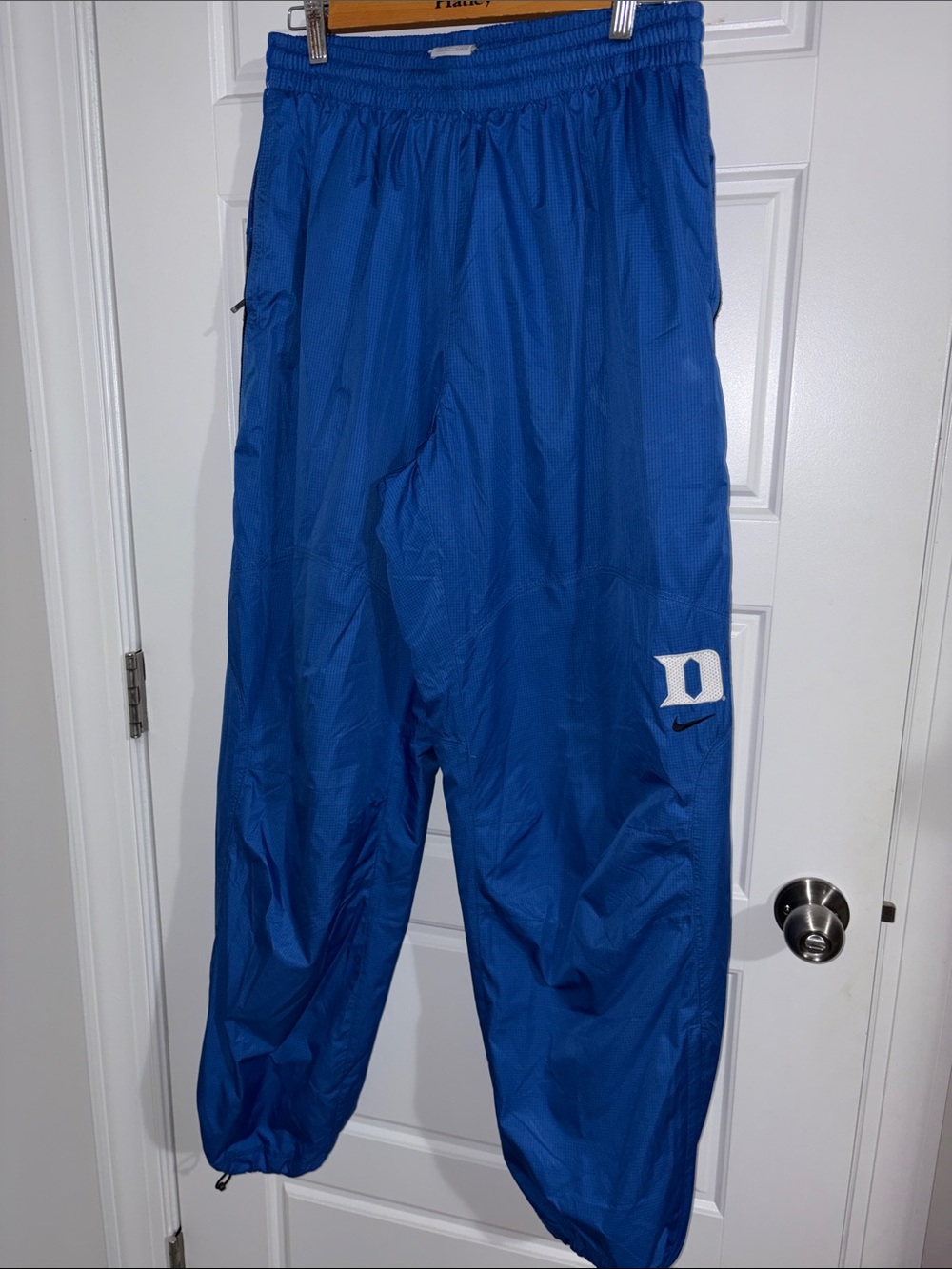 Nike men’s Blue Windbreaker Track Pants with Duke Logo